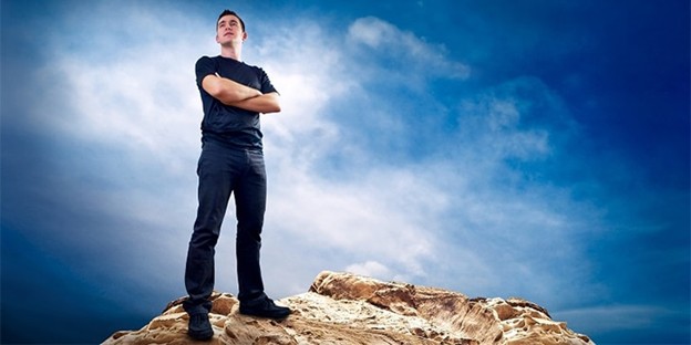 Man standing on hill while achieving hypnosis-supported transformation with Sherwood Park Hypnosis